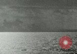 Image of US Navy aircraft bombing island Saipan Northern Mariana Islands, 1944, second 13 stock footage video 65675067413