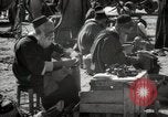 Image of People at work in marketplaces of Marrakech Morocco North Africa, 1942, second 49 stock footage video 65675067431
