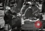 Image of People at work in marketplaces of Marrakech Morocco North Africa, 1942, second 51 stock footage video 65675067431