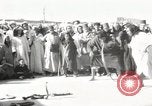 Image of Outdoor performers entertain spectators in Marrakech Morocco North Africa, 1942, second 1 stock footage video 65675067432