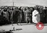 Image of Outdoor performers entertain spectators in Marrakech Morocco North Africa, 1942, second 5 stock footage video 65675067432