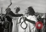 Image of Outdoor performers entertain spectators in Marrakech Morocco North Africa, 1942, second 13 stock footage video 65675067432