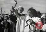 Image of Outdoor performers entertain spectators in Marrakech Morocco North Africa, 1942, second 15 stock footage video 65675067432
