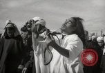 Image of Outdoor performers entertain spectators in Marrakech Morocco North Africa, 1942, second 19 stock footage video 65675067432