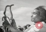 Image of Outdoor performers entertain spectators in Marrakech Morocco North Africa, 1942, second 24 stock footage video 65675067432
