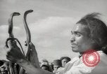 Image of Outdoor performers entertain spectators in Marrakech Morocco North Africa, 1942, second 25 stock footage video 65675067432