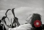 Image of Outdoor performers entertain spectators in Marrakech Morocco North Africa, 1942, second 30 stock footage video 65675067432