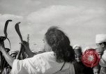 Image of Outdoor performers entertain spectators in Marrakech Morocco North Africa, 1942, second 32 stock footage video 65675067432