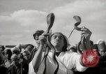 Image of Outdoor performers entertain spectators in Marrakech Morocco North Africa, 1942, second 38 stock footage video 65675067432