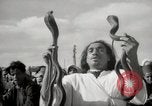 Image of Outdoor performers entertain spectators in Marrakech Morocco North Africa, 1942, second 39 stock footage video 65675067432