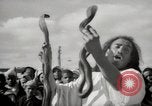 Image of Outdoor performers entertain spectators in Marrakech Morocco North Africa, 1942, second 40 stock footage video 65675067432