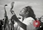 Image of Outdoor performers entertain spectators in Marrakech Morocco North Africa, 1942, second 43 stock footage video 65675067432