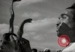 Image of Outdoor performers entertain spectators in Marrakech Morocco North Africa, 1942, second 48 stock footage video 65675067432