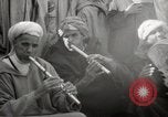 Image of Outdoor performers entertain spectators in Marrakech Morocco North Africa, 1942, second 51 stock footage video 65675067432