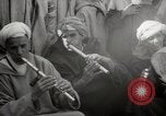 Image of Outdoor performers entertain spectators in Marrakech Morocco North Africa, 1942, second 52 stock footage video 65675067432