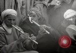 Image of Outdoor performers entertain spectators in Marrakech Morocco North Africa, 1942, second 53 stock footage video 65675067432