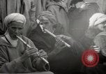 Image of Outdoor performers entertain spectators in Marrakech Morocco North Africa, 1942, second 54 stock footage video 65675067432