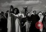 Image of Outdoor performers entertain spectators in Marrakech Morocco North Africa, 1942, second 62 stock footage video 65675067432
