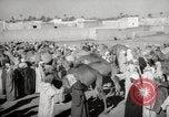 Image of Camels offered for sale at outdoor market in Marrakech Morocco North Africa, 1942, second 22 stock footage video 65675067433