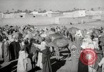 Image of Camels offered for sale at outdoor market in Marrakech Morocco North Africa, 1942, second 26 stock footage video 65675067433