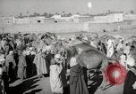 Image of Camels offered for sale at outdoor market in Marrakech Morocco North Africa, 1942, second 37 stock footage video 65675067433