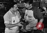 Image of automobile workers Detroit Michigan USA, 1950, second 58 stock footage video 65675067508