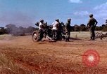 Image of 1st Cavalry Division artillerymen firing 105mm Howitzer Plei Me Vietnam, 1965, second 5 stock footage video 65675067579