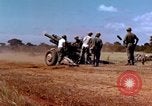 Image of 1st Cavalry Division artillerymen firing 105mm Howitzer Plei Me Vietnam, 1965, second 10 stock footage video 65675067579