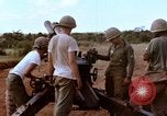 Image of 1st Cavalry Division artillerymen firing 105mm Howitzer Plei Me Vietnam, 1965, second 18 stock footage video 65675067579