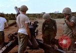 Image of 1st Cavalry Division artillerymen firing 105mm Howitzer Plei Me Vietnam, 1965, second 19 stock footage video 65675067579