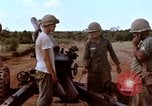 Image of 1st Cavalry Division artillerymen firing 105mm Howitzer Plei Me Vietnam, 1965, second 21 stock footage video 65675067579