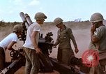 Image of 1st Cavalry Division artillerymen firing 105mm Howitzer Plei Me Vietnam, 1965, second 25 stock footage video 65675067579