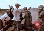 Image of 1st Cavalry Division artillerymen firing 105mm Howitzer Plei Me Vietnam, 1965, second 26 stock footage video 65675067579
