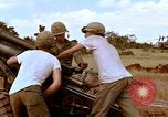 Image of 1st Cavalry Division artillerymen firing 105mm Howitzer Plei Me Vietnam, 1965, second 27 stock footage video 65675067579