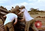 Image of 1st Cavalry Division artillerymen firing 105mm Howitzer Plei Me Vietnam, 1965, second 32 stock footage video 65675067579