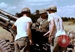 Image of 1st Cavalry Division artillerymen firing 105mm Howitzer Plei Me Vietnam, 1965, second 41 stock footage video 65675067579