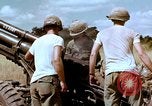 Image of 1st Cavalry Division artillerymen firing 105mm Howitzer Plei Me Vietnam, 1965, second 42 stock footage video 65675067579