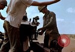 Image of 1st Cavalry Division artillerymen firing 105mm Howitzer Plei Me Vietnam, 1965, second 56 stock footage video 65675067579