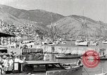 Standbild Touristen verlassen Schiff mit dem Motorboot zu besuchen Vargas Venezuela, 1936, aus Sekunde 27 historischem Filmmaterial Videoclip 65675067694