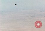 Image of Firebee drone suspended from CH-3 Sea King helicopter California United States USA, 1971, second 1 stock footage video 65675067709