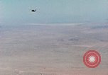 Image of Firebee drone suspended from CH-3 Sea King helicopter California United States USA, 1971, second 4 stock footage video 65675067709