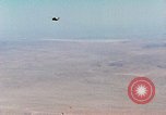 Image of Firebee drone suspended from CH-3 Sea King helicopter California United States USA, 1971, second 5 stock footage video 65675067709