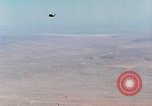 Image of Firebee drone suspended from CH-3 Sea King helicopter California United States USA, 1971, second 6 stock footage video 65675067709