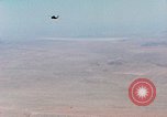 Image of Firebee drone suspended from CH-3 Sea King helicopter California United States USA, 1971, second 8 stock footage video 65675067709
