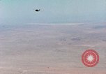 Image of Firebee drone suspended from CH-3 Sea King helicopter California United States USA, 1971, second 9 stock footage video 65675067709