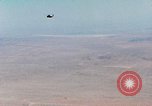 Image of Firebee drone suspended from CH-3 Sea King helicopter California United States USA, 1971, second 10 stock footage video 65675067709