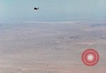 Image of Firebee drone suspended from CH-3 Sea King helicopter California United States USA, 1971, second 13 stock footage video 65675067709