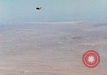 Image of Firebee drone suspended from CH-3 Sea King helicopter California United States USA, 1971, second 16 stock footage video 65675067709