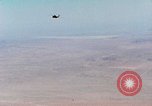 Image of Firebee drone suspended from CH-3 Sea King helicopter California United States USA, 1971, second 18 stock footage video 65675067709