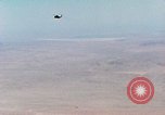 Image of Firebee drone suspended from CH-3 Sea King helicopter California United States USA, 1971, second 19 stock footage video 65675067709